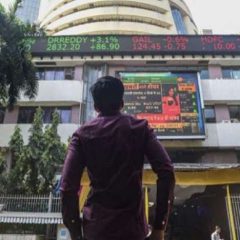 Sensex rebounds 877 points from day's low; closes 296 points higher