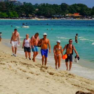 Overseas Tourists On Thai Island Of Phuket Roam Freely